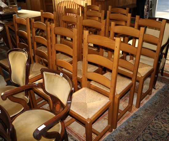 Set of fourteen oak ladderback dining chairs(-)